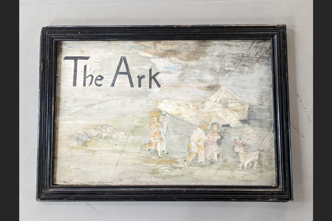 painted and framed sign that says "The Ark"