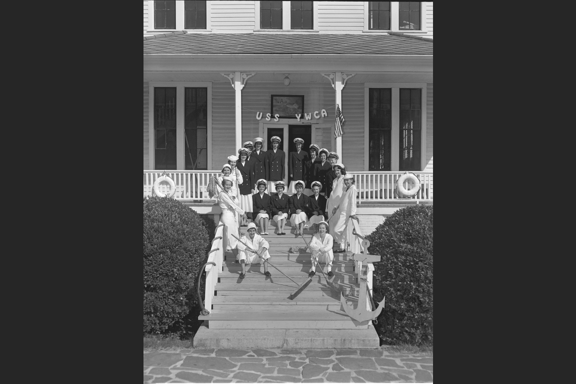 campus chapter of the Young Women’s Christian Association sitting on the stairs to the Ark, in black and white 