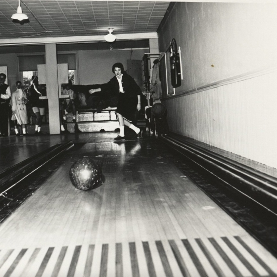 black and white photo of student bowling