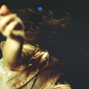 out of focus image of woman's arm